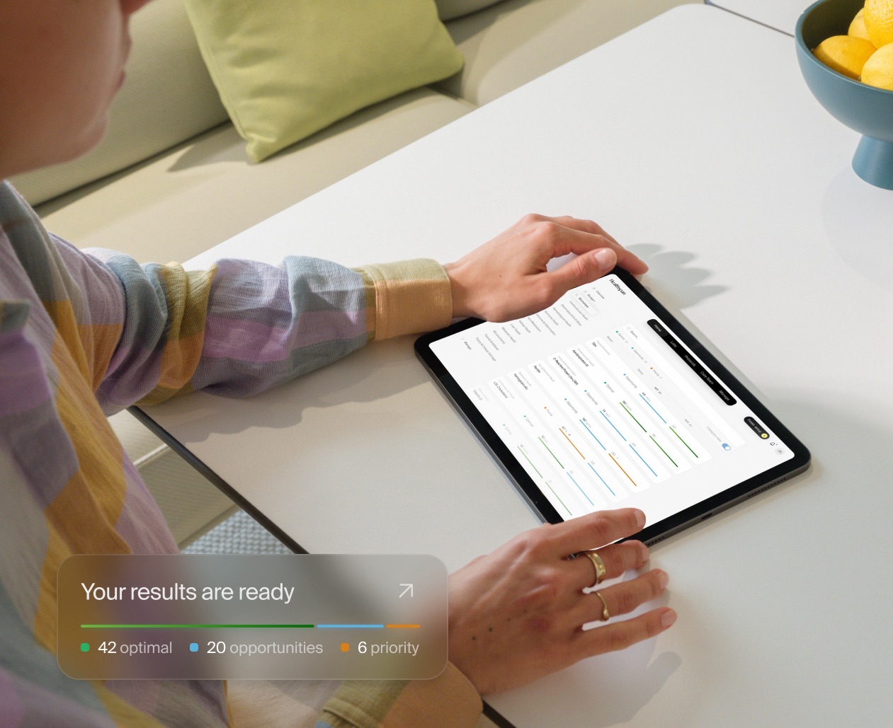 Reviewing biomarker results on a tablet. Your results are ready: 42 optimal, 20 opportunities, 6 priority.